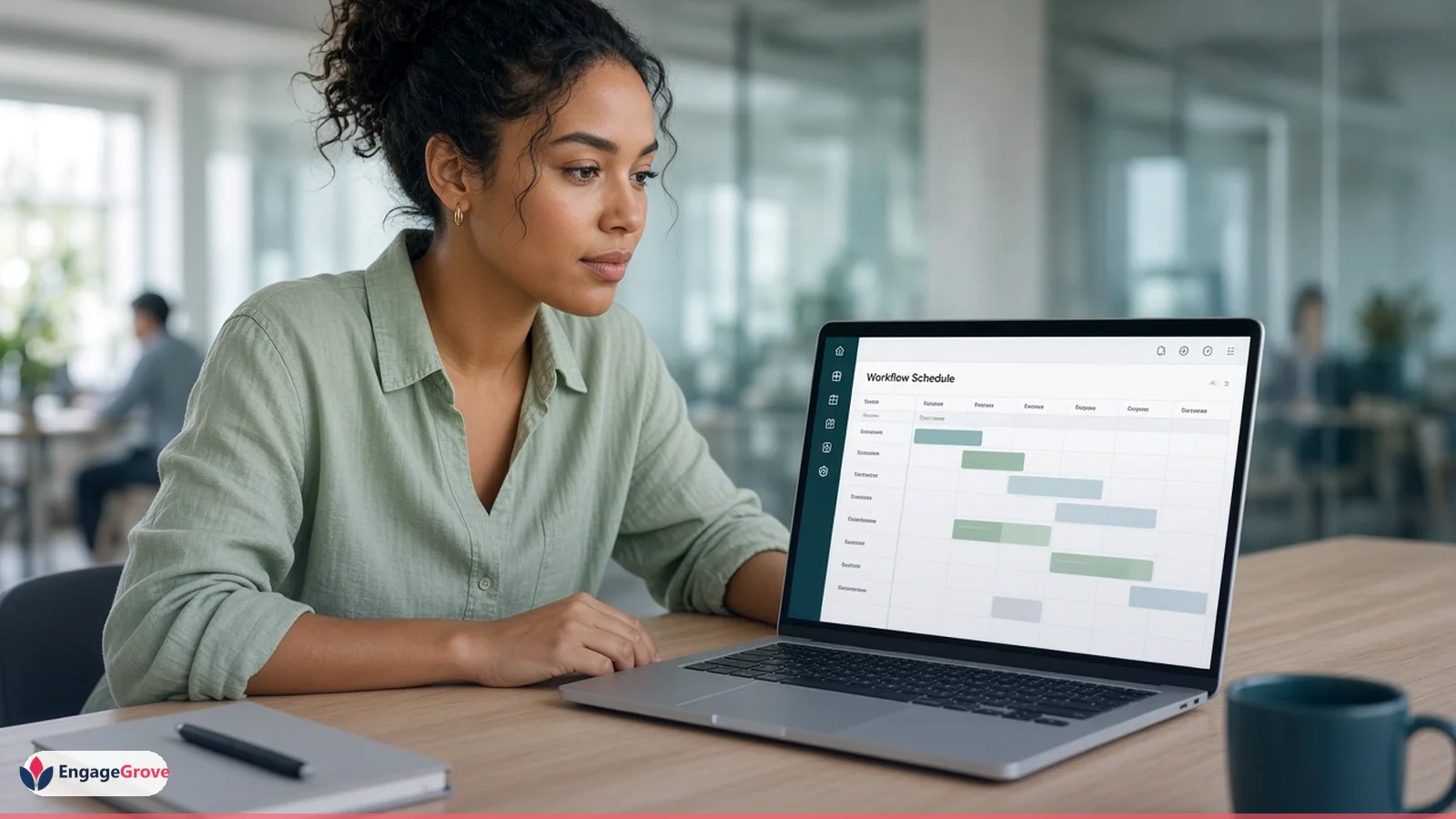 Woman wearing a charcoal blazer planning EngageGrove social media workflows in a modern workspace